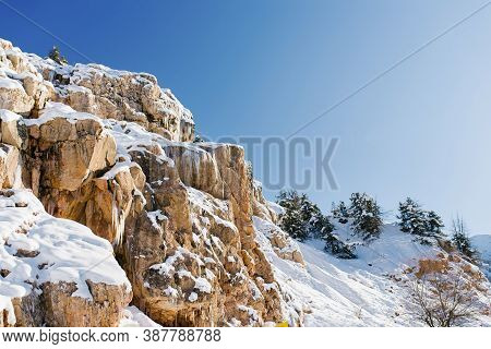 Beautiful Rock Mountains Covered With Snow In Winter In Sunny Weather In Uzbekistan Near The Resort 