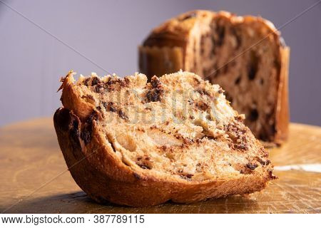 Panettone With Chocolate Chips On Rustic Wood With Gray Background, Selective Focus.