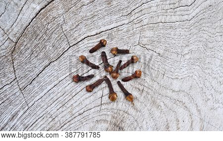 Cloves (flower Buds Of Syzygium Aromaticum). Clipping Paths, Shadow Separated On Wood ;herb For Heal
