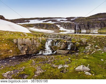 Mountain Lake Flotvatnet With Waterfall. Scenic Region Between Aurland And Laerdal In Norway. Nation