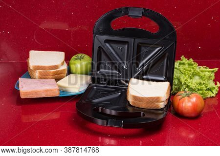 Sandwich Maker; Photo With Ingredients To Make Sandwiches.