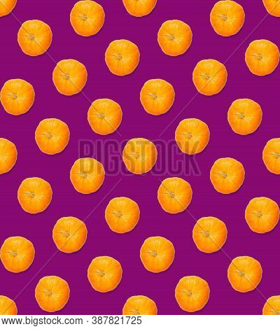 Seamless Pattern With Pumpkin. Autumn Abstract Seamless Pattern Made From Pumpkins On The Purpule Ba