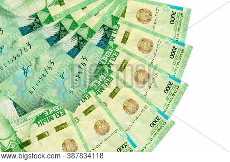 2000 Kazakhstani Tenge Bills Lies Isolated On White Background With Copy Space Stacked In Fan Shape 