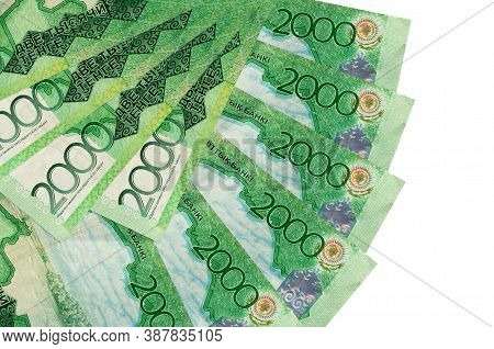 2000 Kazakhstani Tenge Bills Lies Isolated On White Background With Copy Space Stacked In Fan Shape 