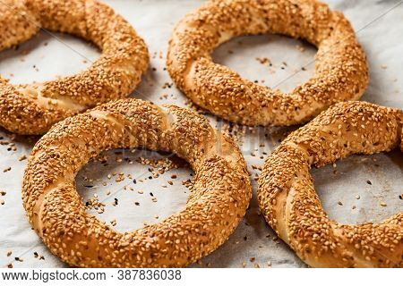 Freshly Baked Simit On A Baking Sheet - A Close-up Sesame Bun (turkish Bagel - Gevrek Or Kuluri). Tr