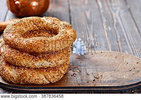 Freshly Baked Simit On A Wooden Table - Sesame Bun With Copy Space (turkish Bagel - Gevrek Or Kuluri