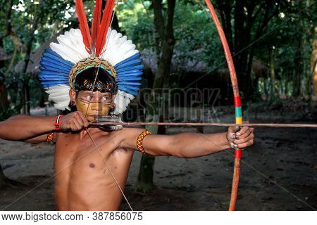Porto Seguro, Bahia / Brazil - April 13, 2006: Pataxo Indians Are Seen In The Jaqueira Village In Th