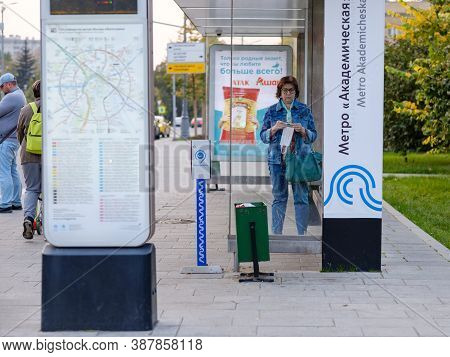 Moscow. Russia. September 25, 2020. An Adult Woman Stands Inside A Public Transit Pavilion While Wai