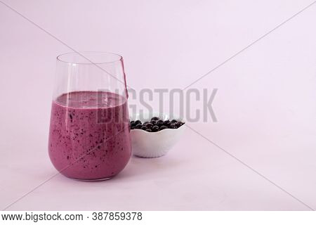 Smoothies Of Berries And Cornflakes On A Pink Background