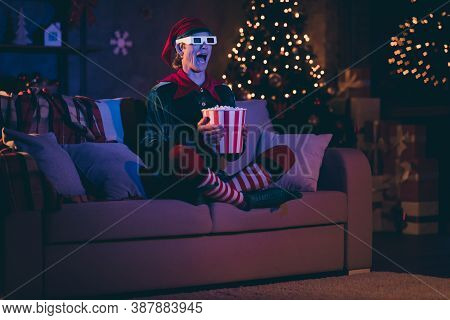 Full Size Photo Of Amazed Elf Sit Couch Watch Three Dimensional Film With Pop Corn Box In Evening Ch