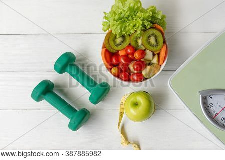 Diet Health Food And Lifestyle Health Concept. Sport Exercise Equipment Workout With Green Apple And