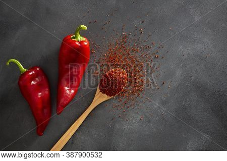 Fresh Capia Peppers And Chili Flakes Or Powder In Wooden Spoon On Grey Rustic Table, Healthy Turkish