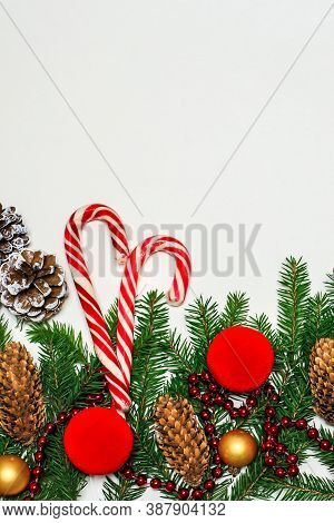 Christmas Composition. Red Decorations On A White Wall. Winter, New Year's Concept. Flat Layout, Iso