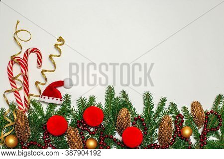 Christmas Composition. Red Decorations On A White Wall. Winter, New Year's Concept. Flat Layout, Iso