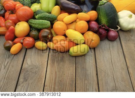 Many Different Non-starchy Vegetables On A Wooden Background. Harvest And Summer Season Concept.