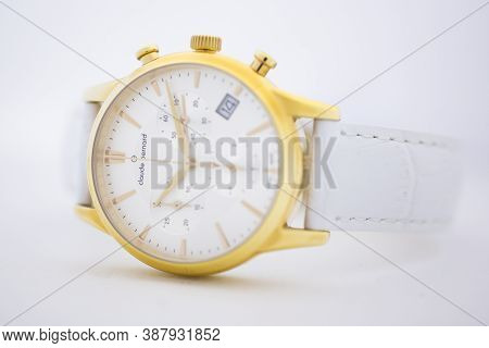 Geneve, Switzerland 01.10.2020 - Claude Bernard Man Swiss Made Watch Gold Pvd Coating White Dial Lea