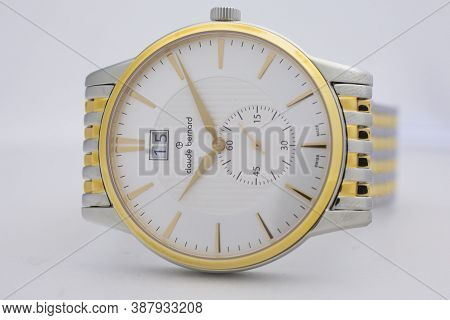 Geneve, Switzerland 01.10.2020 - Claude Bernard Swiss Made Watch Gold Pvd Coating White Dial Isolate