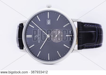 Geneve, Switzerland 01.10.2020 - Claude Bernard Man Swiss Made Watch Blue Dial Leather Strap Isolate