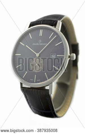 Geneve, Switzerland 01.10.2020 - Claude Bernard Man Swiss Made Watch Black Dial Leather Strap Isolat