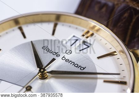 Geneve, Switzerland 01.10.2020 - Claude Bernard Man Swiss Made Watch Gold Pvd Coating White Dial Lea