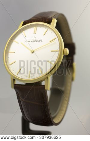 Geneve, Switzerland 01.10.2020 - Claude Bernard Swiss Made Watch Gold Pvd Coating White Dial Leather