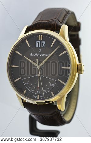 Geneve, Switzerland 01.10.2020 - Claude Bernard Man Swiss Made Watch Gold Pvd Coating Leather Strap 
