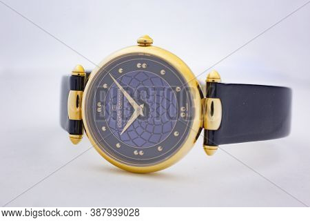 Geneve, Switzerland 01.10.2020 - Claude Bernard Swiss Made Watch Gold Pvd Coating Blue Dial Leather 