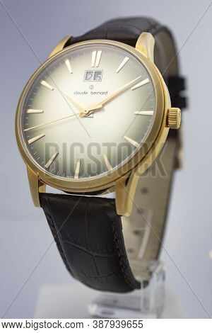 Geneve, Switzerland 01.10.2020 - Claude Bernard Man Swiss Made Watch Gold Pvd Coating Leather Strap 
