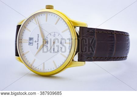 Geneve, Switzerland 01.10.2020 - Claude Bernard Man Swiss Made Watch Gold Pvd Coating White Dial Lea