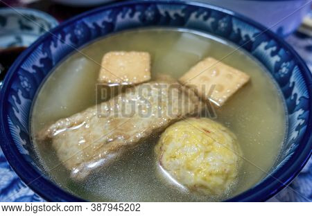 Close-up Of A Bowl Of Simple Homemade Japanese Oden Soup, Contsisting Fish Cakes And Fish Balls, And
