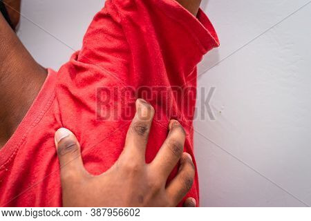Itching Of Skin Diseases - Man Uses His Hand To Scratch The Armpit For Itch Skin. Not Something To D