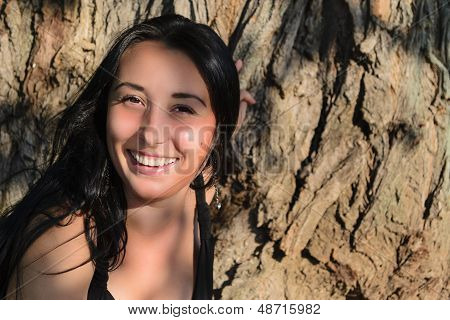The Girl Near A Tree Trunk