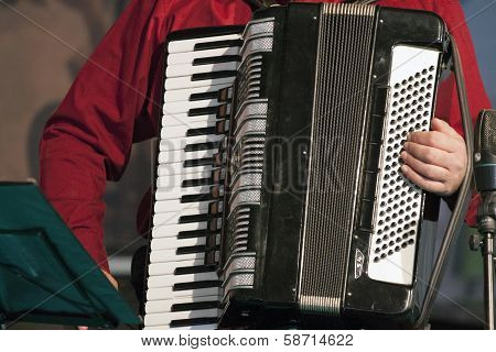 Playing music instrument.