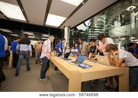 HONG KONG, CHINA - NOVEMBER 11, 2012: Buyers and shop assistants at Apple store in Hong Kong. Store is in a shopping center IFC Mall, it is very popular with locals and tourists visiting Hong Kong.