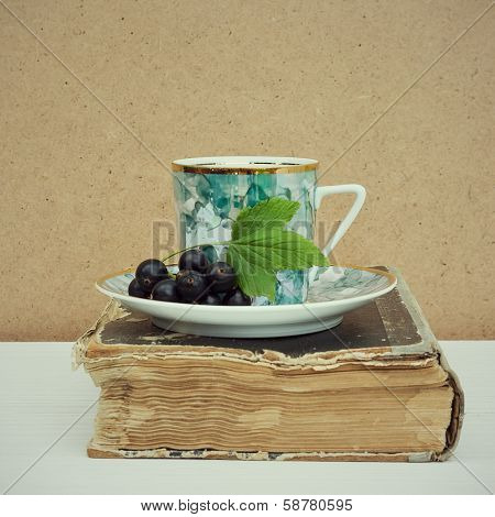 Vintage Books And Cup Of Tea On Wooden Table