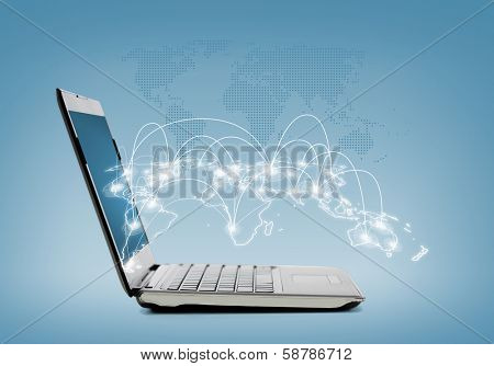 technology and networking concept - laptop computer with map hologramm