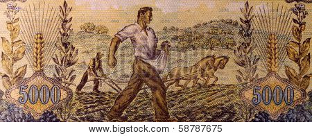 GREECE - CIRCA 1942: Farmers Sowing and Plowing on 5000 Drachmai 1942 Banknote from Greece.