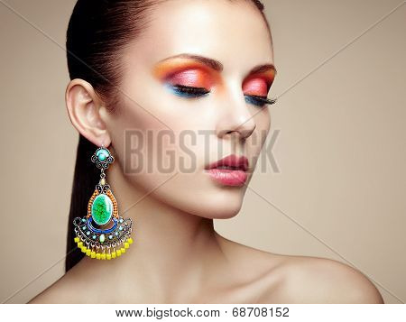 Portrait Of Beautiful Young Woman With Earring. Jewelry And Accessories