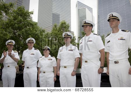 NEW YORK - MAY 23, 2014: Rear Admiral Scott A. Stearney applauds the naval officers promoted during the joint military services ceremony at the National September 11 Memorial site.
