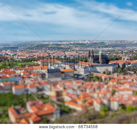 Aerial view of Hradchany part of Prague: the Saint Vitus Cathedral and Prague Castle, view from Petrin Observation Tower with tilt shift toy effect shallow depth of field. Prague, Czech Republic