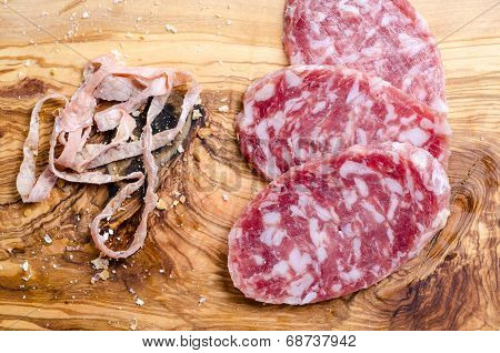 Sliced Salami On A Wood Board
