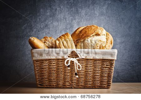 Delicious Bread And Rolls In Wicker Basket