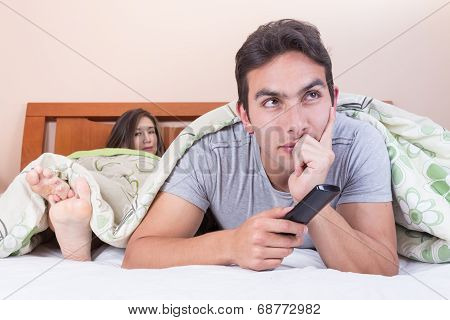 married couple lying in bed
