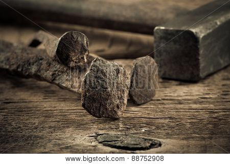 Vintage Hammer With Nails On Wood Background