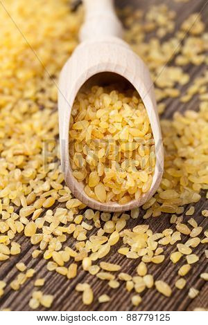 Vegan healthy bulghur dieting nutrition wheat grain in spoon on