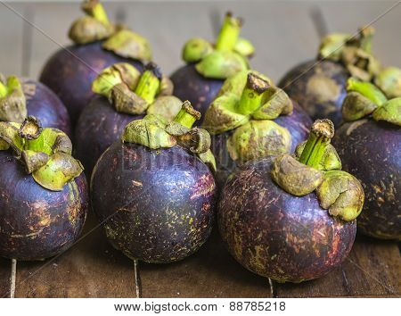 Mangostins And Fresh Green Leaf