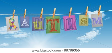 Autism awareness ribbon against digitally generated grey background