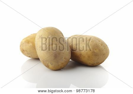 Three Brown Potato's on White Background
