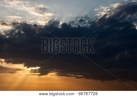Cloudscape With The Sun Rays Radiating From Behind The Cloud