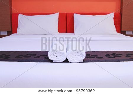 White Clean Towels On The Hotel Bed